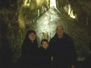Andrea and Tony, with Jack in the Waitomo Caves (yes, we had to go underground to get a family photo!).