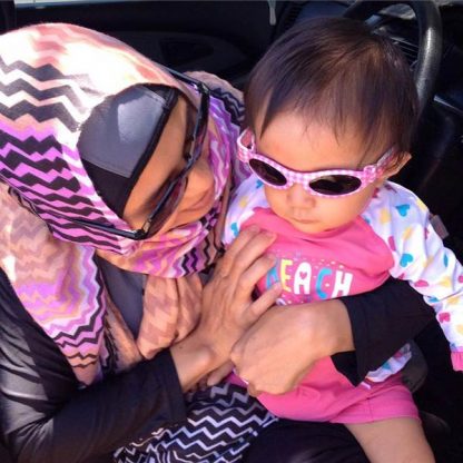 Mum with baby in Adventure Banz Pink Check sunnies