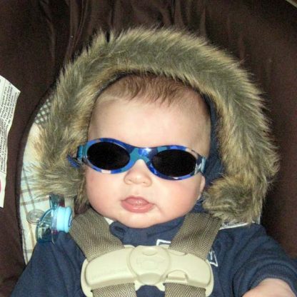 Baby wearing Baby Banz Adventure Banz Camo Blue sunglasses
