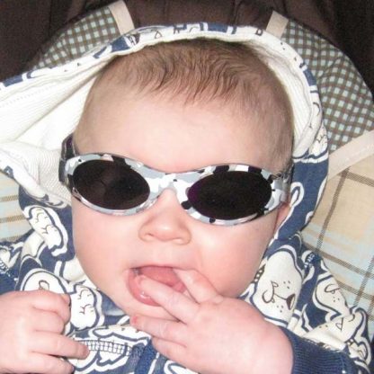 Baby Banz Adventure Banz Camo Grey sunglasses on a baby