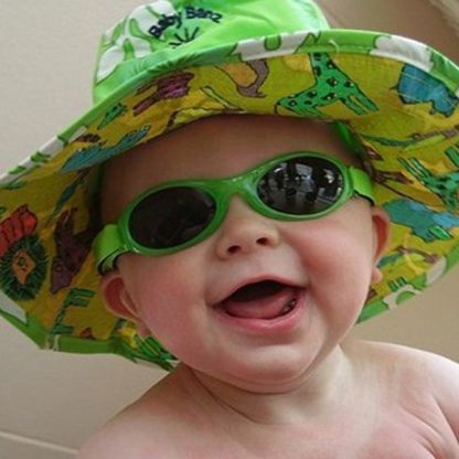 Baby Banz Adventure Banz Lime Green sunglasses on a happy baby