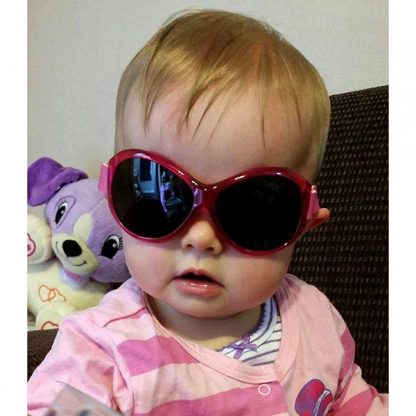 Baby in Retro Banz Berry Pink sunglasses