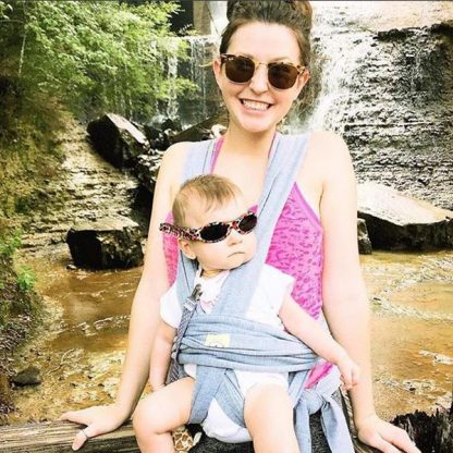 Mother and baby wearing sunglasses