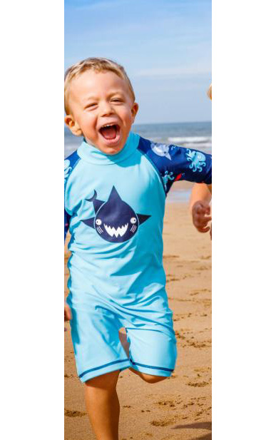 Boy wearing Turquoise Shark swimsuit