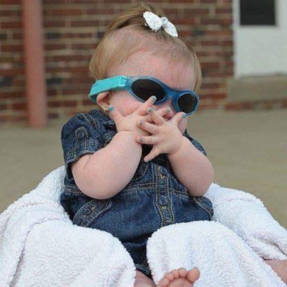 Cute baby girl in Adventure Banz Aqua sunglasses