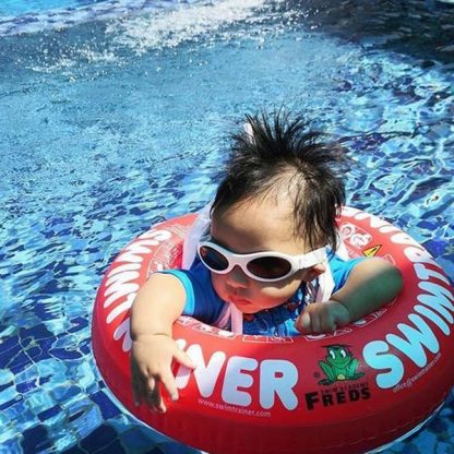Baby in pool wearing Adventure Banz White sunglasses
