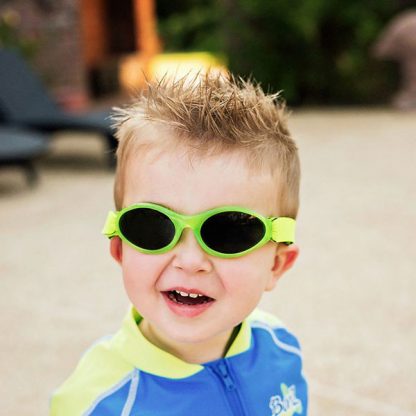 Boy in Adventure Banz sunglasses in Lime Green