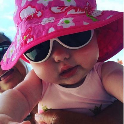 Baby wearing Hibiscus Pink Reversible Sunhat