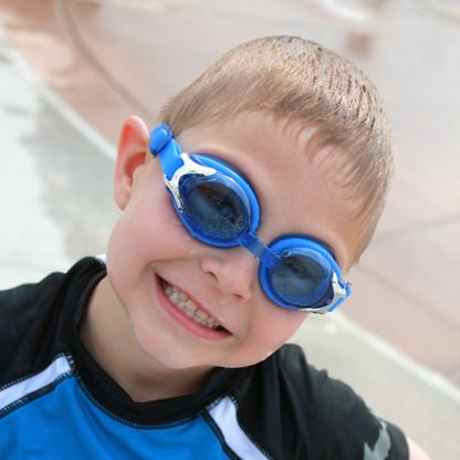 Boy wearing blue swimming goggles