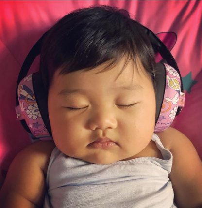 Baby asleep in Mini Earmuffs Peace