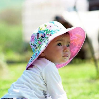Small child wearing Reversible Sunhat in Botanical