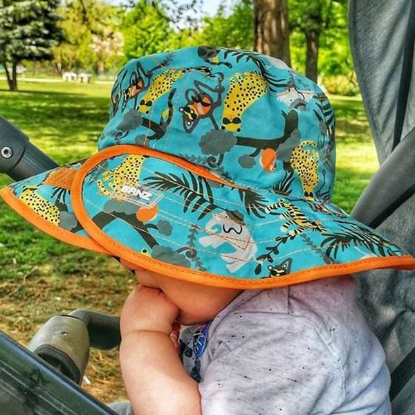 Reversible Sunhat Jungle on a baby